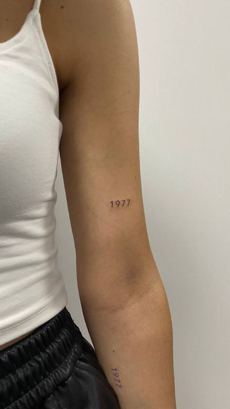 Date Placement Tattoos, Minimalist Tattoo On Arm For Women, Year Tattoos On Arm, Dainty Tattoos Year, Year Tattoo Number Dainty, Date On Arm Tattoo, Birth Year Tattoo Arm, 1964 Tattoo Number Font, Moms Birth Year Tattoo