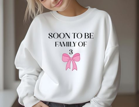 🌟 Exciting News! 🌟 Our adorable pregnancy announcement sweatshirt is here, and it's available in four stunning colors: white, sand, grey, and red! 💖👶 With the cutest message "Soon to be a family of 3" printed on it, this cozy sweatshirt is perfect for announcing your bundle of joy. 🤰🎉 Let everyone share in your joy and anticipation with this cute and stylish addition to your wardrobe. 🌈 Order yours today and get ready to spread the love! 😍💕 Ivf Announcement, Pregnancy Sweater, Funny Pregnancy Shirts, New Mom Shirt, Funny Pregnancy, Family Of 3, Pregnancy Humor, Cute Messages, New Mom Gift