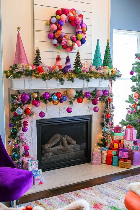 25+ Christmas Mantle Decor Inspirations for a Contemporary Holiday Pool Noodle Christmas Mantle, Christmas Garland Ideas For Mantle, Colorful Christmas Mantle, Xmas Garland Ideas, Whimsical Christmas Decor Ideas, Christmas Mantle Decor Ideas, Christmas Mantle Decorations, Garland Fireplace, Christmas Fireplace Mantels