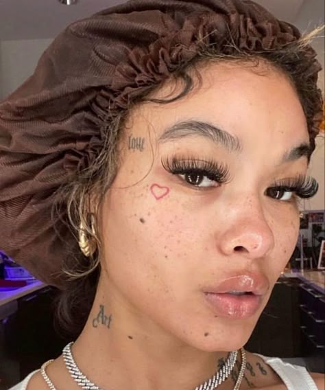 India Love Face Tattoos, Lil Face Tattoos, Love Heart Face Tattoo, Girls With Face Tattoos, Baddie Tats Under Breast, Fake Face Tattoo, Cute Face Tats, Small Face Tattoo, Pretty Face Tattoos