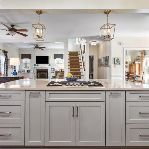 Cabinets- Double stack cabinets in 410F Linen by Waypoint Living Space with a 410F Painted Stone Island

Countertops- Diamond White Quartzite

Features: Cooktop in island, built in bench seat, double oven, warm accents

#greycabinets #kitchenisland #stackedcabinets #waypoint #whitecabinets
#greyisland #cooktop #faucet #benchseat Kitchen Design With Island Stove, Kitchen Cooktop Island, Gas Stove On Island Kitchen, Kitchen Island With Sink And Stove Top, Large Island With Cooktop And Seating, Kitchens With Stove In Island, Islands With Stove Tops, Large Kitchen Island With Cooktop, Kitchen Island With Cooktop And Seating