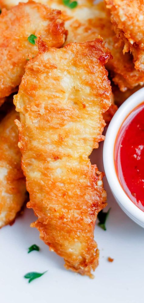 A plate of parmesan chicken tenders. Keto Oven Fried Chicken Tenders, Keto Breaded Chicken Tenders, Low Carb Chicken Tender Recipes, Low Carb Chicken Fingers, Low Carb Chicken Strips, Keto Fried Chicken Tenders, Chicken Tenders Low Carb, Healthy Breaded Chicken, Leftover Chicken Ideas