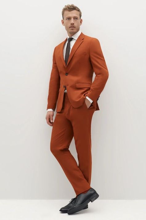 Burnt orange is the hue du jour, and while aisles might not be fashion runways, they’re certainly not exempt from taking inspiration from them. Whether you’re interested in rocking a burnt orange suit on your wedding day, asking your wedding party to dress in burnt orange or seeking other wedding ideas to incorporate the rusty shade, we’ve got you covered with these 10 ways to use burnt orange in your wedding. Terracotta Suit Men, Burnt Orange Suits For Men, Burnt Orange Tuxedo, Sunset Theme Wedding, Wedding Decor Orange, Burnt Orange Suit, Orange Wedding Decor, Rust Orange Wedding, Tux Colors