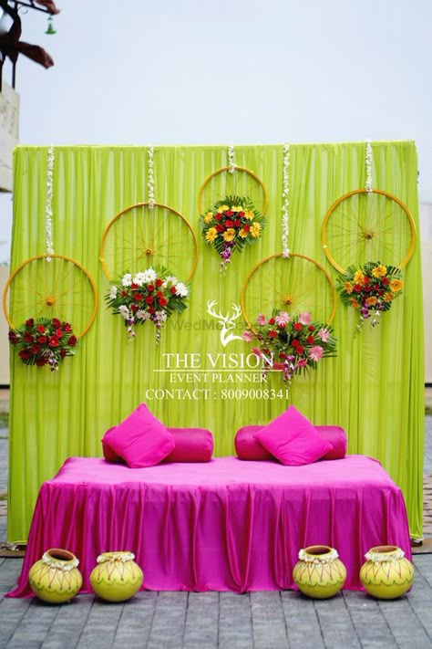 Photo By The Vision Event - Wedding Planners Mahendi Background Decoration, Indian Mehndi Function Decoration, Simple Event Decorations, Mehendi Simple Decoration, Simple Mehandi Decorations, Mehandi Wedding Decoration, Wedding Mehendi Decoration, Mehandi Decorations Ideas, Mahendi Stage Decoration