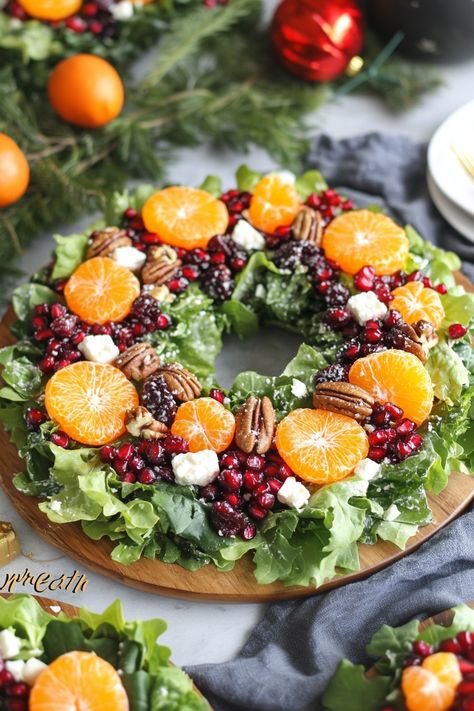 Create a stunning Winter Salad Wreath for your holiday table! Vibrant greens, citrus, pomegranate, and feta come together in this festive dish. A perfect mix of flavors and textures for Christmas celebrations. Pin now and make this show-stopping salad for your holiday menu! Xmas Fruit Salad Christmas, Christmas Salad Wreath Ideas, Xmas Food Decorations, Pioneer Woman Christmas Wreath Salad, Christmas Wreath Salad Recipe, Citrus Christmas Centerpiece, Salad For Buffet, Holiday Party Menu Ideas Appetizers, Festive Fruit Platter Christmas