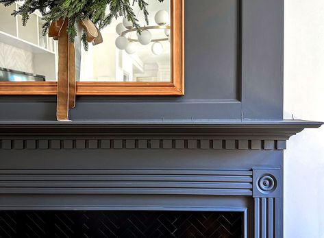 1910 Fireplace Mantle, Dark Blue Fireplace Mantle, Black Painted Fireplaces, Colonial Fireplace Mantle, Trim Above Fireplace, Fireplace Makeover Paint, Black Fireplace Makeover, Fireplace Color Ideas, Navy Fireplace