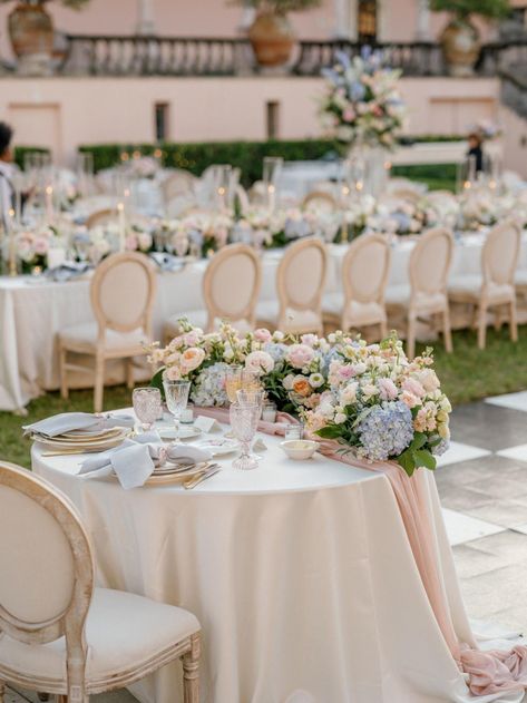 Photography: http://hunterryanphoto.com Soft Colors Wedding, Muted Colorful Wedding Flowers, Circle Reception Table, Pastel Wedding Flowers Table, Pastel Flowers Wedding Decoration, Candlestick Centerpiece Wedding Round Table, Neutral Pastel Wedding, Wedding Reception Linens, Sage Wedding Centerpieces Round Table