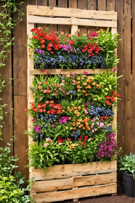 20 Unconventional Pallet Projects For DIY Fanatics Wood Pallet Planters Diy Projects, Diy Garden Pallet Ideas, Pallet Yard Art, Planting In Pallets, Pallet Wall Planter, Pallet Flower Wall, Wooden Pallet Projects Garden, Pallet Flower Planter, Wood Palette Ideas