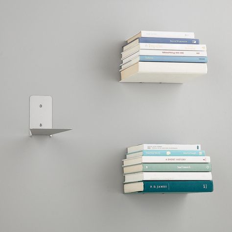 A set of floating shelves that turns books (the most beautiful things of all!) into storage units in and of themselves. Floating Books, Floating Bookshelf, Decorative Shelving, Floating Bookshelves, Wall Bookshelves, The Container Store, Bookshelves Diy, Estantes Flotantes, Shelves In Bedroom