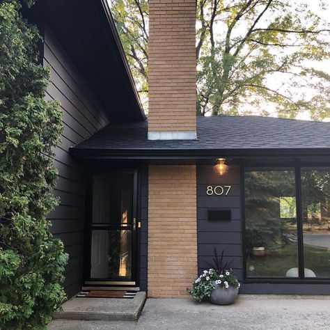 Mid-Century Modern Homes on Instagram: “Super impressive fixer upper work done by @ourhideawayhome. Winnipeg, Manitoba. 🙌🏻👏🏻” Mid Century Modern Exterior, Mid Century Exterior, Brick Chimney, Modern House Number, Exterior Makeover, Exterior Remodel, Casa Exterior, Exterior Paint Colors, Black Exterior