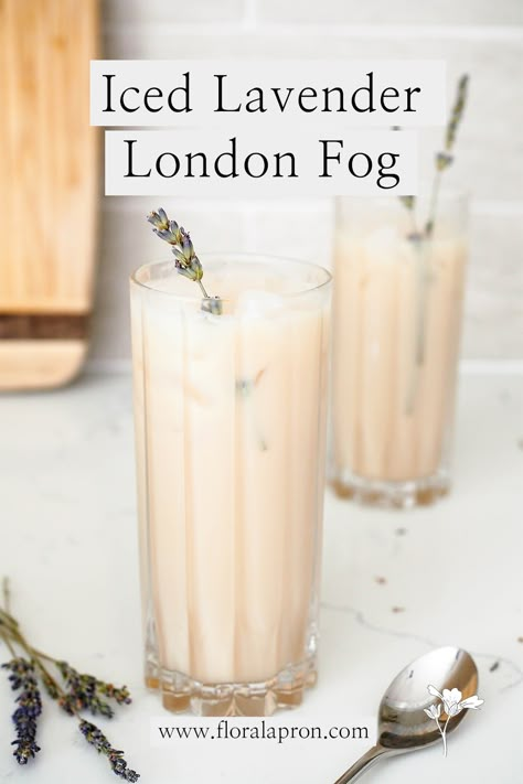 Two glass highball glasses are filled with milky tea lattes and topped with a sprig of lavender. Baking With Lavender Syrup, Drinks Made With Lavender Syrup, Lavender Syrup Drink Recipes, Uses For Lavender Syrup, Recipes Using Lavender Syrup, Lavender London Fog Recipe, Iced London Fog Recipe, How To Make London Fog Tea, How To Make A London Fog At Home