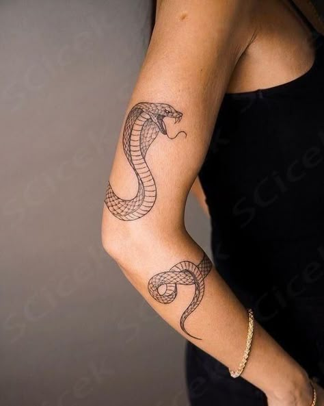 Contemplating whether a spiritual snake tattoo suits you? Here is the powerful spiritual meaning of snakes. Snake Around Upper Arm Tattoo, Snake Tattoo Arm Wrap, Snake Arm Band Tattoo, Snake Tattoo Design Arm, Snake Bicep Tattoo, Snake Tattoos Arm Wraparound, Spiritual Snake Tattoo, Snake Wrist Tattoo, Snake Around Arm Tattoo