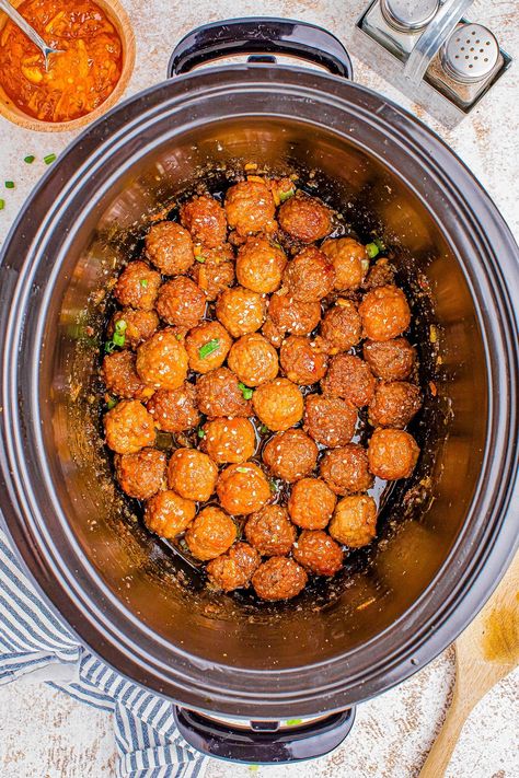 Slow Cooker Orange Meatballs - 🍊🎉🙌🏻 The EASIEST 5-ingredient recipe for savory, sweet, and saucy meatballs that are infused with the flavor of orange marmalade and soy sauce! Whether you need a no-fuss weeknight dinner idea that's as easy as 'set it and forget it' or a GREAT party appetizer recipe, everyone LOVES these juicy, flavorful meatballs! Peach Meatballs Crock Pot, Honey Sriracha Meatballs Crockpot, Apricot Bbq Meatballs, Meatballs Crockpot Orange Marmalade, Slow Cooker Sweet And Sour Meatballs With Pineapple, Orange Meatballs, Saucy Meatballs, Flavorful Meatballs, Fish Pasta