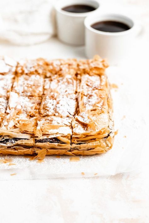 Creamy chocolate hazelnut custard made of milk and semolina between crispy layers of buttery phyllo - this easy Nutella Bougatsa will become your new favorite Greek breakfast! #bougatsarecipe #bougatsa #nutellarecipe #greekbougatsa #greekdessert #greek #semolinacustard Bougatsa Recipe, Signature Desserts, Greek Breakfast, Nutella Recipes Easy, Phyllo Pastry, Greek Pastries, Bakery Menu, Greek Desserts, Chocolate Hazelnut Spread