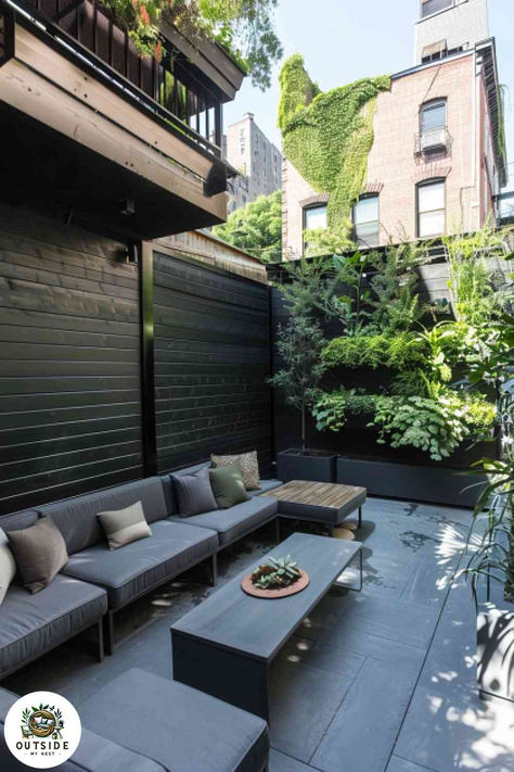 Black subway tiles add an urban edge to a narrow patio. A cozy seating nook and vertical garden complete the charming space. Tap to explore more urban patio ideas! Black Stone Patio Ideas, Urban Patio Ideas, Narrow Patio Ideas, Narrow Patio, Narrow Backyard, Narrow Backyard Ideas, Urban Patio, Black Porcelain Tiles, Seating Nook