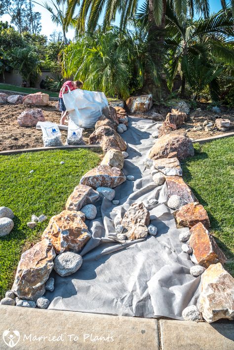 The building of a dry creek bed Rocks Backyard Ideas, Dry Creek Bed With Pond, Natural Rock Landscaping Ideas, Dry Creek Bed For Drainage Rain Garden, River Rock Landscaping Dry Creek Bed Rain Garden, Dry Riverbed Landscaping Slope, River Rock Beds Landscaping, Rock Garden For Wet Areas, What To Do With Big Rocks In Yard