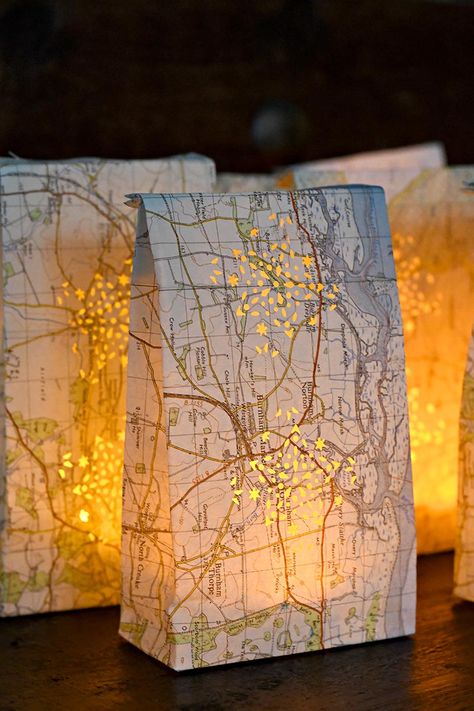 Brighten up those dark winter nights with these DIY map luminary bags. Use remote controlled tea lights to turn the lights on and off. #tealights #luminary #mapcrafts Diy Luminaries, Luminaries Diy, Diy Maps, Luminary Bags, Lanterns Diy, Luminaries Bags, Diy Map, Paper Lanterns Diy, Tea Light Lanterns