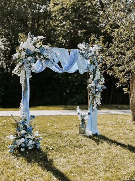 Blue and white wedding decoration! 🦋 #weddingdecor #weddingideas #bri... | TikTok Dusty Blue Wedding Arbor, Wedding Arch Dusty Blue, Simple Wedding Arch Ideas, Dusty Blue Wedding Arch, Arbor Ideas Wedding, Outside Wedding Ceremonies, Simple Wedding Arch, Pastel Blue Wedding, Chuppah Flowers