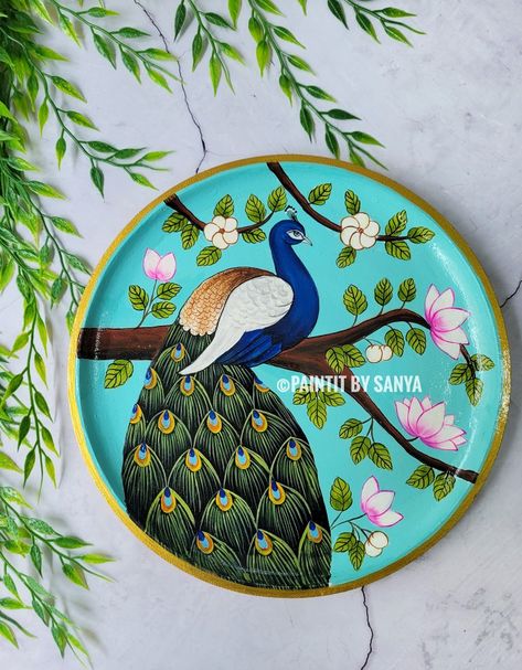 Embrace the elegance of a peacock pichwai painting wall plate, bringing art and positive vibes to your space. 🦚✨ #peacockpainting #pichwai #wallplate #wallplates #festivedecor Pichwai Art Peacock, Pichwai Art Paintings Peacock, Round Pichwai Painting, Peacock Pichwai Painting, Simple Pichwai Painting, Pichwai Paintings Peacock, Painting Ideas On Plates, Pichwai Wall Painting, Pichwai Rangoli