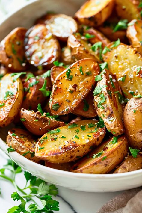 These roasted fingerling potatoes are the ultimate side dish! The crispy exterior and garlic and herb flavor is simply irresistible. Bbq Sides Potatoes, Herb Roasted Fingerling Potatoes, Recipes Using Fingerling Potatoes, Greek Fingerling Potatoes, Garlic Fingerling Potatoes, Roasted Fingerling Potatoes Air Fryer, Baked Fingerling Potatoes In The Oven, Fingerling Potato Recipe Oven, Roast Fingerling Potatoes