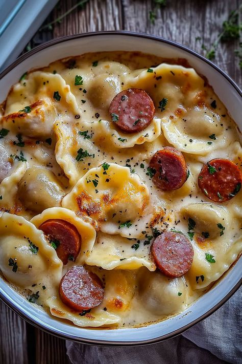 Crockpot Pierogi Casserole with Kielbasa is the perfect comforting dish for those busy weeknights. This simple one-pot meal features savory kielbasa and tender pierogies enveloped in a rich cheese sauce, all cooked to perfection in your slow cooker. Ready in just 3-6 hours, it’s a satisfying dinner option that your whole family will love. Serve hot and garnish with green onions for an extra touch! Crockpot Pierogi Casserole, Pierogi Casserole With Kielbasa, Kielbasa Crockpot, Pierogies And Kielbasa, Pierogi Casserole, Pierogi Recipe, Creamy Cheese Sauce, Kielbasa Sausage, Tasty Pasta