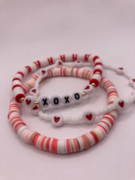 The Valentine's Day stack comes with 7 bracelets-- four seed bead bracelets and 3 clay heishi bead bracelets.  Handmade with love and care and shipped from central Texas ️ Clay Bead Bestie Bracelet Ideas, Cute Bracelet Ideas Words, Cute Brackets To Make, Red And White Clay Bead Bracelet, Birthday Bracelet Ideas Clay Beads, Clay Beads Friendship Bracelet Ideas, Clay Bracelet Color Ideas, Bracelets With Flat Beads, How To Make Clay Beads Bracelet