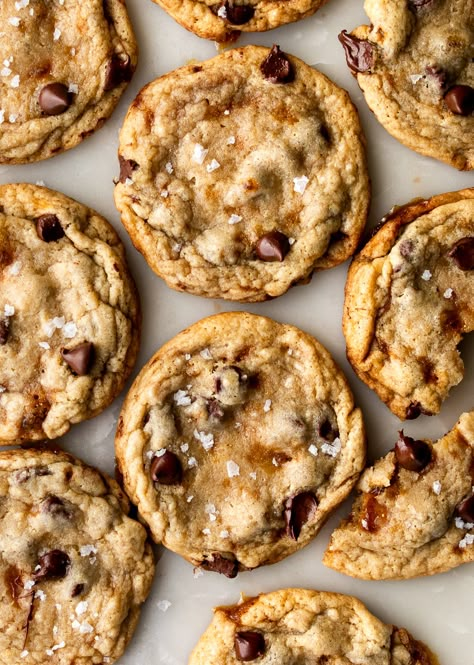 Crunchy, chewy bits of caramel and puddles of chocolate chips lace this vanilla-forward chocolate chip cookie! Aside from the extra step of making the hard caramel (which takes just minutes, no candy thermometer needed!), this is an easy, one-bowl recipe with no rest time for the dough! Chocolate Chip Cookies Caramel, Chewy Caramel Cookies, Carmel Bits Cookie Recipes, Chocolate Chip Cookies With Caramel Bits, Salted Caramel Baking, Medium Rare Cookies, Christmas Cookies With Carmel, Extra Chewy Chocolate Chip Cookies, Salted Caramel Cookies Easy