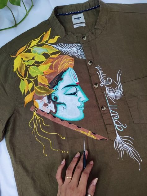 Paint on @paint_blue skye Fabric Painting On Mens Shirt, Krishna Painting On Cloth, Fabric Paint Designs In Blouse, Krishna Painting On Fabric, Panjabi Painting Design For Men, Mural Painting On Shirt, T Shirt Painting Ideas Men, Krishna Fabric Painting, Fabric Paint Designs Creative