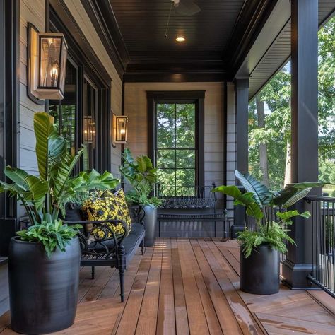 7+ Stylish Black Front Porch Decorating Ideas for a Modern Appeal • 333k+ Inspiring Lifestyle Ideas & Images Dark Porch Ideas, Front Verandah Ideas Entrance, Black Covered Deck, Front Porch Ideas Plants, Black Porch Posts, Black Outdoor Furniture Decorating Ideas, Dark Wood Porch, Moody Front Porch, Industrial Front Porch