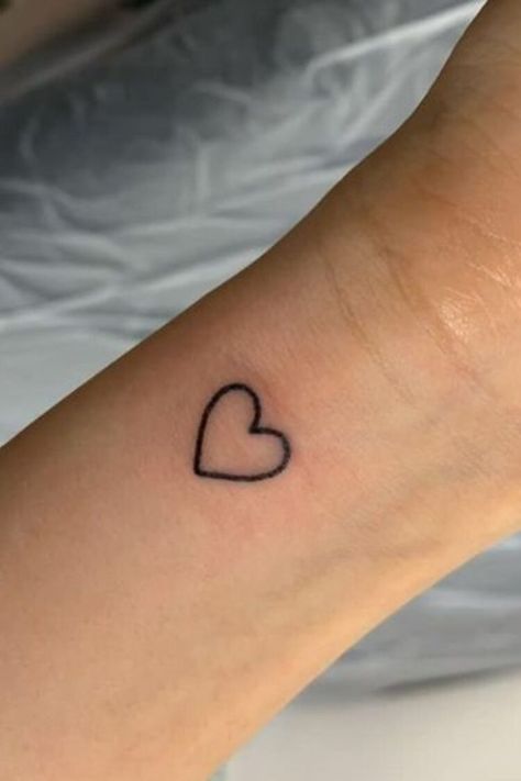 25 Amazing Heart Tattoos For Women To Try In 2023 Small Heart Tattoo On Wrist, Wrist Heart Tattoo, Amazing Tattoos For Women, Mini Heart Tattoo, Heart Tattoos For Women, A Heart Tattoo, Watercolor Heart Tattoos, Little Heart Tattoos, Love Heart Tattoo