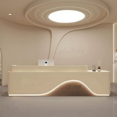 Our reception desk, with its unique design, ensures a memorable experience for every client. Size: 39.37" H x 94.48" W x 23.62" D, Color: Beige/Brown | Ivy Bronx Kasside Rectangular Manufactured Wood Reception Desk Wood in Brown | 39.37 H x 94.48 W x 23.62 D in | Wayfair Reception Ceiling Design, Creative Reception Desk Design, Reception Desk Lighting, Unique Reception Desks, Dental Design Interior, Wood Reception, Curved Reception Desk, Wood Reception Desk, Office Reception Design