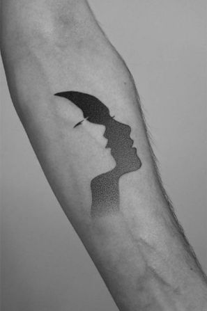 Shadow Negative Space Tattoo. A negative space tattoo with a dotted face design. Click through for 19 negative space tattoo ideas. #negativespacetattoo #negativespacetattooideas #tattooideas #tattoos IG: @pawelindulski Sticker Sketch, Contemporary Tattoo, Negative Space Tattoo, Shadow Tattoo, Typography Tattoo, Tattoo Dotwork, Dotwork Tattoo, Gemini Tattoo, Tattoo Equipment