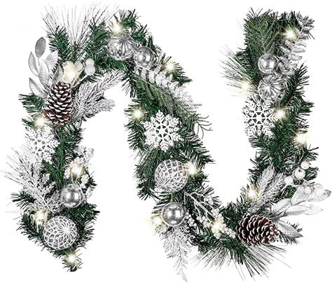 Amazon.com: Valery Madelyn Pre-Lit 6 Feet Frozen Winter Silver White Christmas Garland with Shatterproof Ball Ornaments, Snowflakes and Silver White Leaves, Battery Operated 20 LED Lights: Home & Kitchen Christmas Garland With Lights, Garland With Lights, Xmas Garland, Christmas Garland, White Christmas, Battery Operated, Led, Christmas, Silver