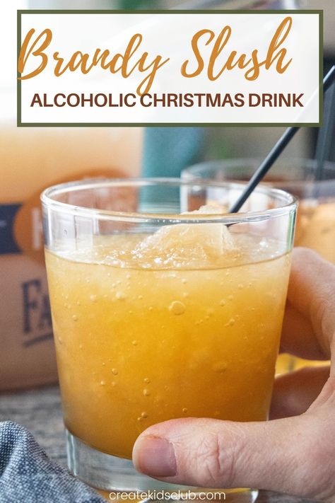 Brandy Slush is an alcoholic drink recipe made at Thanksgiving and Christmas in the midwest. It's a delicious slush recipe made in an ice cream pail - perfect for transporting! #brandyslush #brandyslushrecipe #thanksgivingdrinkrecipes #alcoholicdrinkrecipes #alcoholicchristmasdrinkrecipes #createkidsclub Peach Brandy Slush, Brandy Slush Recipe Without Tea, Brandy Slush Wisconsin, Apricot Brandy Slush, Brandy Slush Recipe Wisconsin, Holiday Slush Recipes, Christmas Slush Recipes, Brandy Old Fashioned Wisconsin, Brandy Drink Recipes