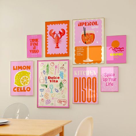 Bohemian-inspired dorm room decor featuring a gallery wall with pink and orange posters. Poster Sets Wall Art, Pink And Orange Kitchen Decor, Orange Pink Decor, Wall Poster Inspo Bedroom, Colourful Wall Prints, Pink And Orange Room Aesthetic, Room Posters Aesthetic Ideas, Pink And Orange Room Decor, Boho Chic Dorm Room