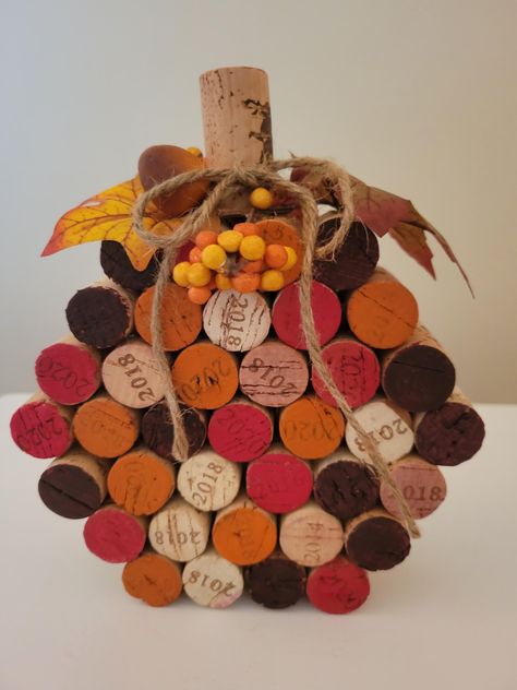 Add a touch of rustic charm to your autumn decor with my handcrafted wine cork pumpkin. Each pumpkin is assembled from reclaimed wine corks, creating a unique and eco-friendly decoration. Hand painted to give that rustic charm. Accented with fall leaves, berries and jute rope bow. Perfect for Thanksgiving table, fall festivals or as a thoughtful  gift. Wine Cork Basket, Wine Cork Star, Wine Cork Pumpkins Diy, Handmade Thanksgiving Decorations, Eco Halloween Decorations, Cork Pumpkins Fall Crafts, Wine Bottles Crafts, Fall Crafts For Seniors Assisted Living, Cork Art Projects