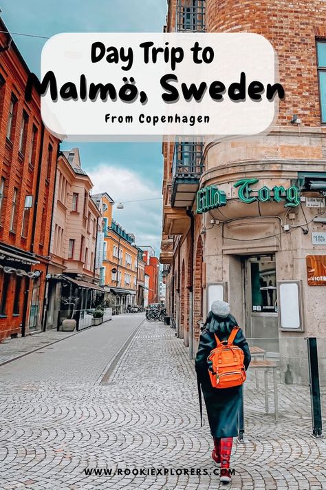 A stunning picture of Lilla Torg with girl walking carrying a backpack on a cold and cloudy day. The picture reads "Day trip to Malmo, Sweden, from Copenhagen by RooKiExplorers". Read now or save the pin to the ultimate guide to plan your day trip to Malmo. Copenhagen Denmark Travel, Denmark Vacation, Malmo Sweden, Copenhagen Travel, Travel Iceland, Denmark Travel, Sweden Travel, Ireland Vacation, Coastal City