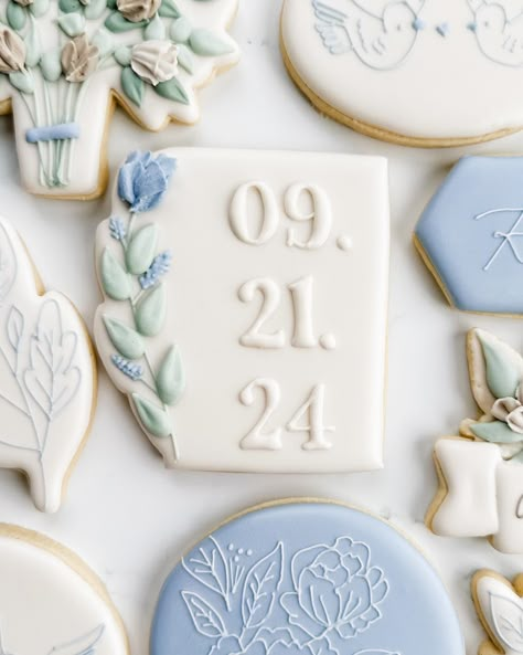 This sweet bridal shower set was winning the polls, so here’s the full set! Swipe to see closeups, including their sweet pups!. My favorite are the simple cookies with the tiny line details. The blue with the white floral, leaf cookie, and the birds were from her invitation! I love this elegant, minimalist, and floral set! . #weddingcookies #bridalshowercookies #bridecookies #floralcookies #flowercookies #somethingbluebridal #bluewedding #springcookies #engagementcookies #ringcookies #dogcoo... Blue And White Cookies, Something Blue Bridal Shower Cookies, Blue Wedding Cookies, Love In Bloom Cookies, Blue Bridal Shower Cookies, Blue And White Bridal Shower Cookies, Floral Wedding Shower Cookies, Bride Cookies, Wedding Shower Cookies