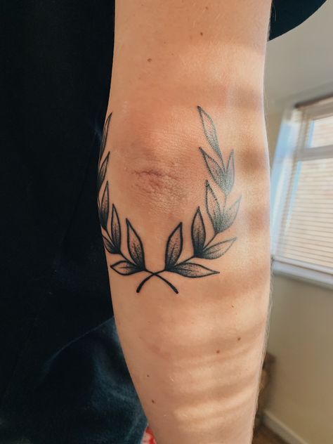 Olive Branch Leg Tattoo Men, Traditional Laurel Tattoo, Wreath Elbow Tattoo, Leaves Elbow Tattoo, Olive Wreath Tattoo Men, Laurel Wreath Tattoo Elbow, Leaf Elbow Tattoo, Olive Branch Elbow Tattoo, Vine Elbow Tattoo