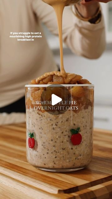 Nicole Keshishian Modic | KALEJUNKIE® on Instagram: "@kalejunkie WARM APPLE PIE OVERNIGHT OATS that you actually must make 🍎🥧. So confession—I am not a huge breakfast person, I am a creative of habit and 95% of the time, I make myself a protein smoothie. BUT this combo of flavors reminded me that change is good and tastes so damn good. These overnight oats are packed with fiber and protein to keep you full and then topped with warm cinnamon apples and drizzled with almond butter on top, for truly—the most delicious brekkie. 

If you want the link to my cute apple glasses, comment LINK or GLASSES!

Follow for more easy, delicious recipes!

Makes 4 servings
2 cups rolled oats (pro tip: if you get quick cook rolled oats, no overnight time needed)
1/4 cup chia seeds
1/2 cup unflavored collag Overnight Oats Video, Warm Cinnamon Apples, Huge Breakfast, Apple Pie Overnight Oats, Apple Topping, Apple Glasses, Yummy Oatmeal, Weekday Breakfast, Warm Apple