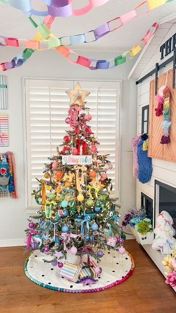 Tina Green | TheBearAndTheFawn on Instagram: "Theo’s bedroom reveal!! 🎄🌈 A rainbow holiday room for my rainbow loving boy! I’ll share a closer look at details soon, but hope you love this as much as we do! I can’t think of a happier space for the holidays💖 Tree: @kingofchristmas Candy cane wreath: @dollartree diy inspired by @ambusheedwithboys & @opal_auktober Magical sign: @chalkdesignsbyme Rainbow garland: @pearlandjane x @kelseyklos collab Tree topper: @michaelsstores Guitar: @loogguitars Flowers: @dollartree Rainbow fabric blanket : @joann_stores Velvet ribbon: @etsy and @anthropologie Stockings: @target last year #rainbowchristmas #colorfulchristmas #christmasinspiration #holidaydecor #kidsholiday #rainbow #colorfuldecor" Rainbow Baby Christmas Tree, Rainbow Tree Decorations, Pastel Rainbow Christmas, Rainbow Ornaments Diy, Rainbow Christmas Tree Ideas, Rainbow Christmas Tree Decorations, Rainbow Christmas Decor, Playroom Christmas, Unicorn Tree