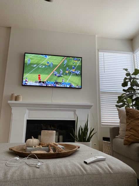 Watching the Chargers game in the living room, featuring neutral decor and the Frame TV. Football House Decor, Sunday Football Aesthetic, Football Sunday Aesthetic, Fall Football Aesthetic, Watching Football Aesthetic, Superbowl Aesthetic, Football Season Aesthetic, Watching Football On Tv, Carson Aesthetic