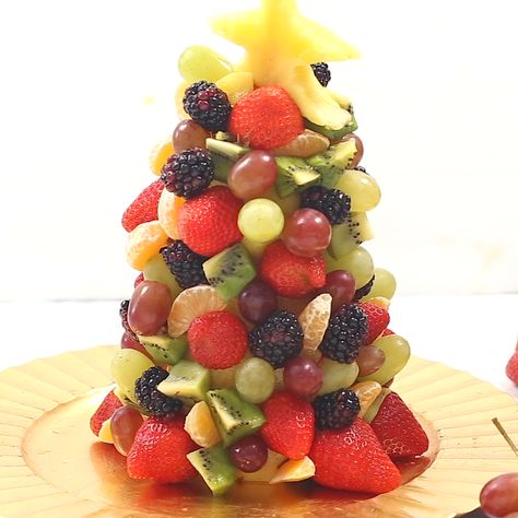 Start a new holiday tradition with a beautiful and fresh Fruit Christmas Tree! Perfect for parties, a dessert table centerpiece, or a healthy treat for Santa. | iowagirleats.com #glutenfree #fruitplatter Creative Christmas Food, Salad For Parties, Braid Blonde Hair, Table Settings For Parties, Fruit Tower, Fruit Slime, Christmas Tree Desserts, Christmas Ideas Food, Holiday Appetizers Christmas