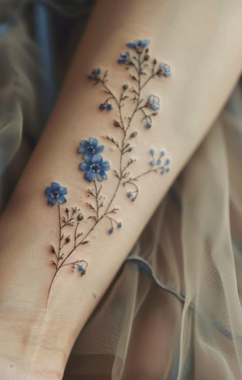 The Beauty and Significance of the Forget Me Not Flower Tattoo Flower Tattoos Colorful, Blue Flowers Tattoo, Color Flower Tattoo, Forget Me Not Flower Tattoo, Anklet Tattoo, Blue Flower Tattoos, Forget Me Not Tattoo, Delicate Tattoos For Women, Wildflower Tattoo