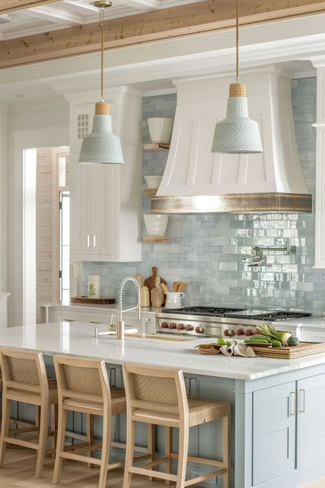 I am drawn to coastal kitchen design for its ability to infuse my home with a sense of laid-back luxury. The combination of light, breezy aesthetics and seaside-inspired elements creates a space that feels both stylish and welcoming, making everyday cooking and dining a delightful experience. New Home Trends Interior Design, Coastal Kitchen Aesthetic, Blue Kitchen Islands With White Cabinets, Southern Coastal Kitchen, Small Coastal Kitchens, Modern Beach House Kitchen Ideas, Coastal Kitchens 2024 Trends, Cozy Coastal Cottage Kitchen, White Kitchen Colored Backsplash