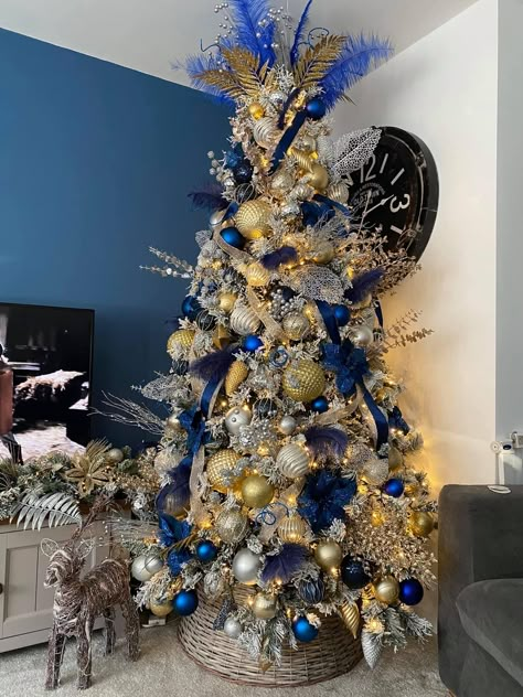 Blue silver and gold Flocked Christmas Trees Decorated Blue And Gold, Blue Gold And White Christmas Decor, Royal Blue Gold Christmas Tree, Christmas Tree Blue Silver And Gold, Blue Decoration Christmas Tree, Silver Gold And Blue Christmas Tree Decor, White Blue And Gold Christmas Tree, Blue And Gold Ornaments Christmas Tree, Christmas Tree With Blue And Gold