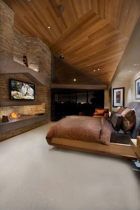 This master bedroom features a natural wood ceiling, a stone fireplace, and access to a private patio. Source: http://www.zillow.com/digs/Home-Stratosphere-boards/Luxury-Bedrooms/ Design Camino, Interior Design Per La Casa, Bedroom Fireplace, Design Del Prodotto, Dream Home Ideas, Fireplace Design, Master Bedrooms, Decor Minimalist, Dream Rooms