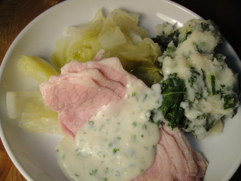 On this side of the Atlantic, corned beef and cabbage may be about as Irish as a dish gets, but according to Darina Allen author of Forgotten Skills of Cooking bacon and cabbage is Ireland's national dish. It calls for whole loin bacon, a British Isles export, which is cooked along with the cabbage, sliced before serving, and paired with a creamy parsley sauce. Forgotten Skills, Bacon And Cabbage, Bacon Cabbage, Irish Bacon, Irish Foods, Parsley Sauce, Irish Traditional, Boiled Ham, Irish Cooking