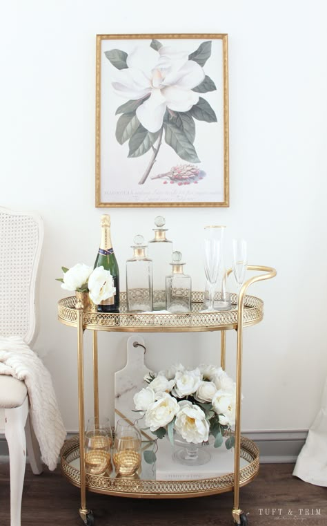 Bar Cart Styling Tips and Ideas with Tuft & Trim Interior Design Neutral Bar Cart Styling, Sophisticated Bar Cart, Bar Cart Sitting Area, Gold Bar Cart Decor, Bar Cart Apartment Small Spaces, Round Bar Cart Styling Ideas, Serving Cart Decor Ideas, Gold Bar Cart Decor Ideas, Bathroom Bar Cart