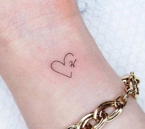 Small heart-shape H tattoo by @tattoo.choi Small Husband Tattoo, Partners Initials Tattoo, T Heart Tattoo, Partner Initial Tattoo, Cute Boyfriend Tattoo Ideas, Heart M Tattoo, Small Tattoos For Husband, Tattoo With Husbands Name Ideas, Ellie Name Tattoo